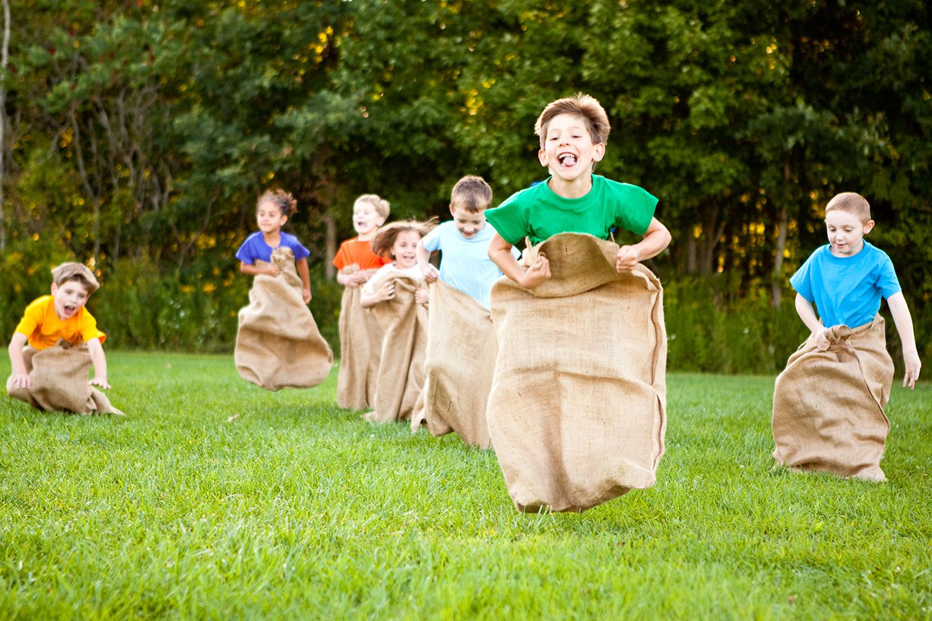 Outdoor party games and sports for children Kids enjoying outdoor party games and sports activities during summer fun