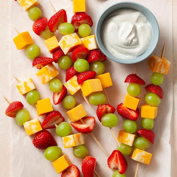 Fun fruit and cheese kabobs for kids Colorful fruit and cheese kabobs arranged for kids lunch snacks