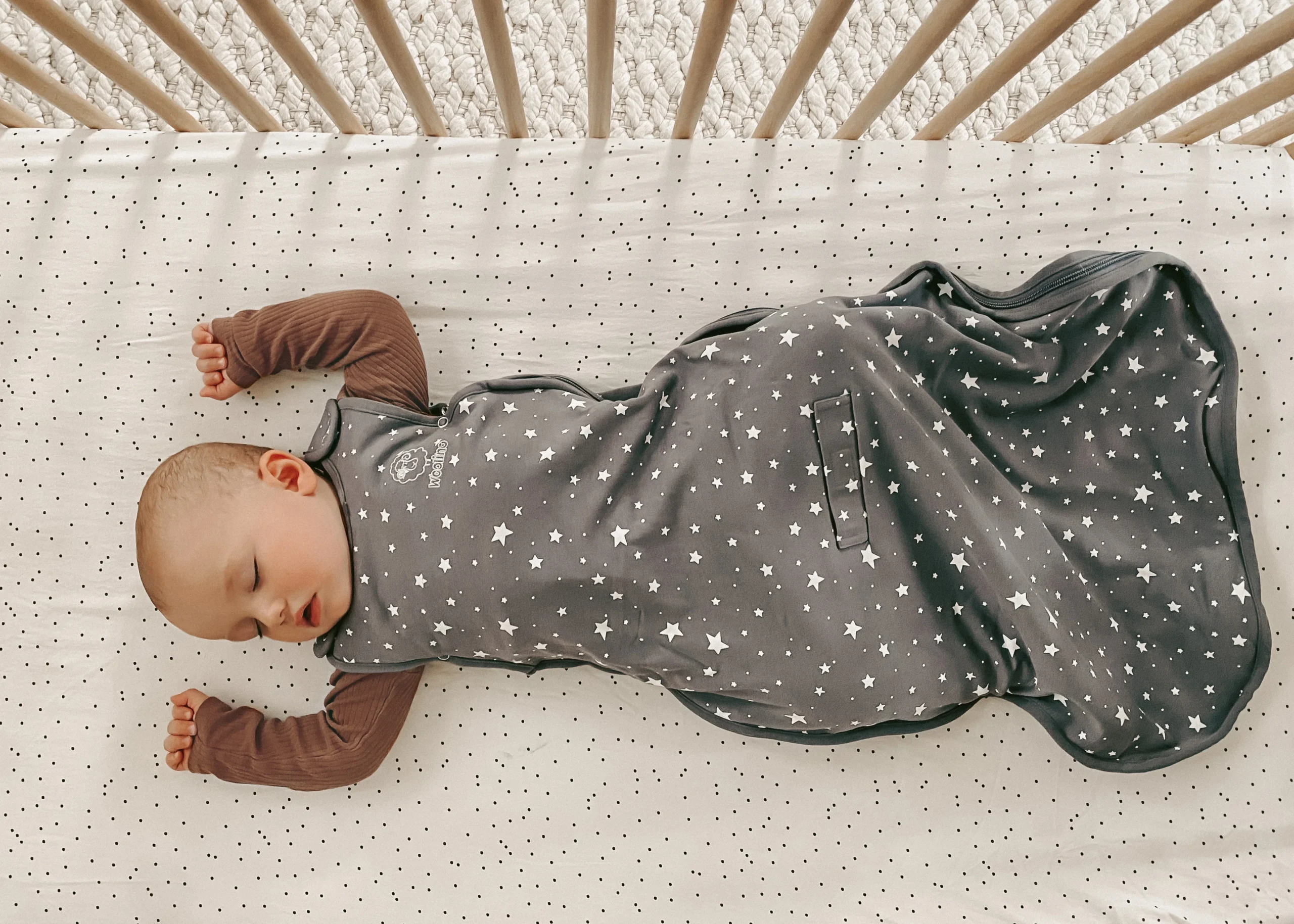 Safe sleep practices with quality sleep sacks for Canadian babies Baby sleeping safely on back in crib wearing Woolino 4 season sleep sack for safe sleep