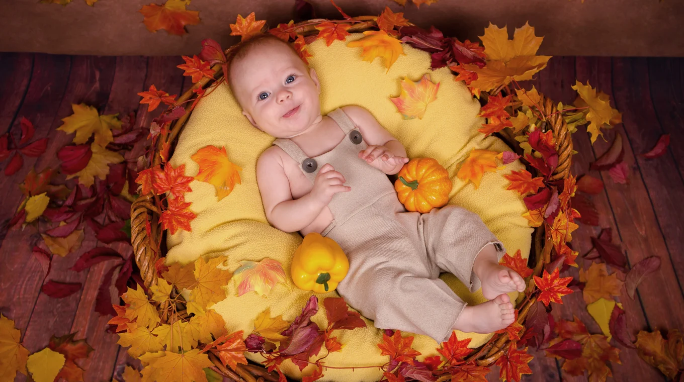 Canadian baby's first Thanksgiving outfit with autumn colors and holiday themes