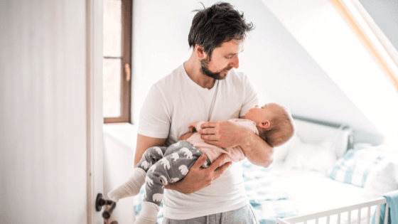 Dad implementing bedtime routine - Canadian family sleep practices Canadian father following bedtime routine with child for healthy sleep habits and family bonding
