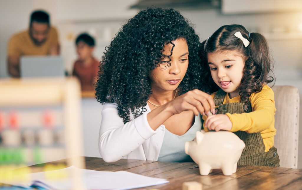 Family budgeting strategies for Canadian households - financial planning together Canadian family working together on budgeting and financial planning at home