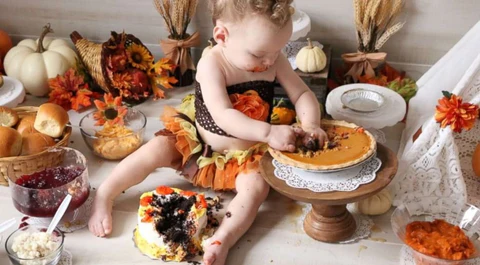 Canadian baby's first Thanksgiving photoshoot with autumn props and family keepsakes