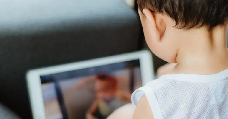 Child enjoying a tech-free creative activity at home