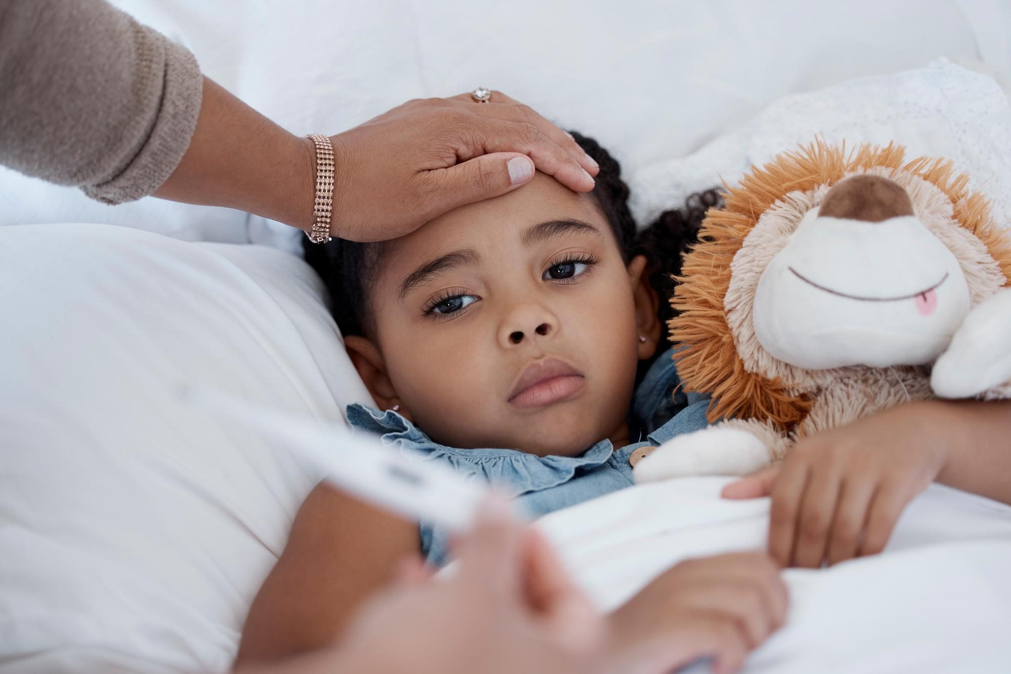 Child eating vitamin-rich fruit to stay healthy during cold and flu season