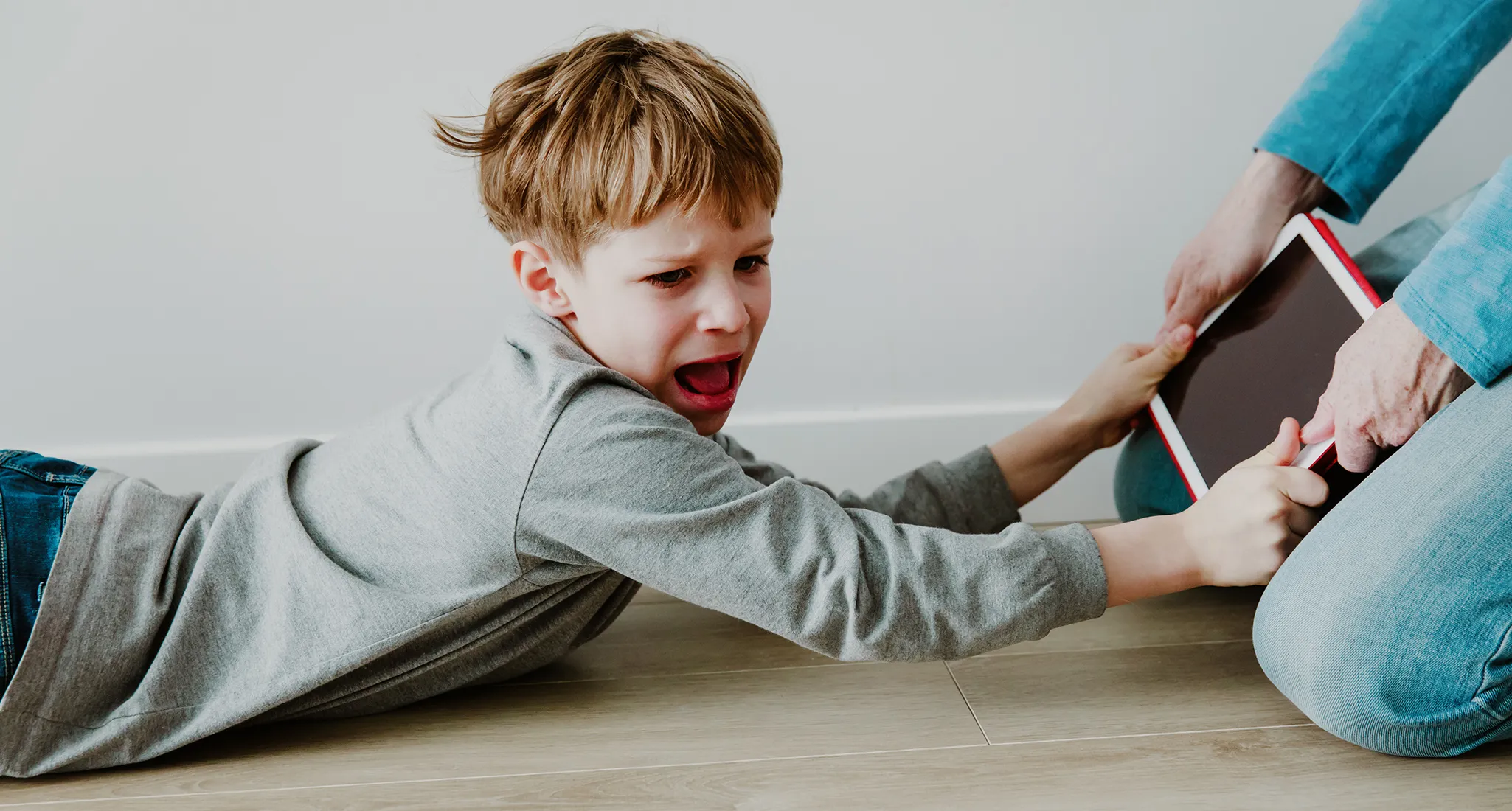 Parent setting screen time limits while spending quality time with child