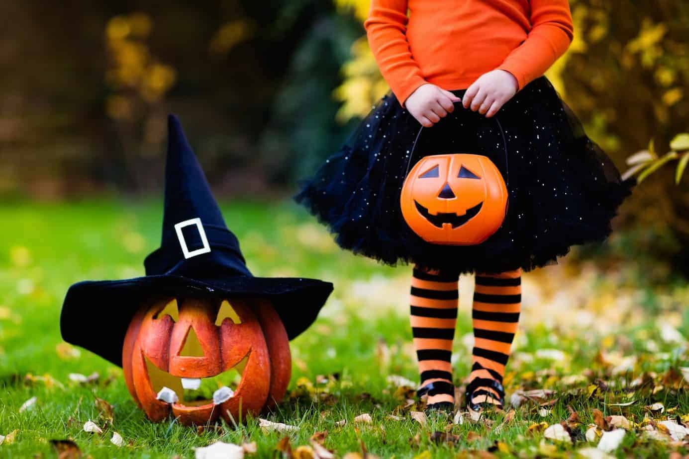 Toddler trick-or-treating safely in Canada with reflective costume elements