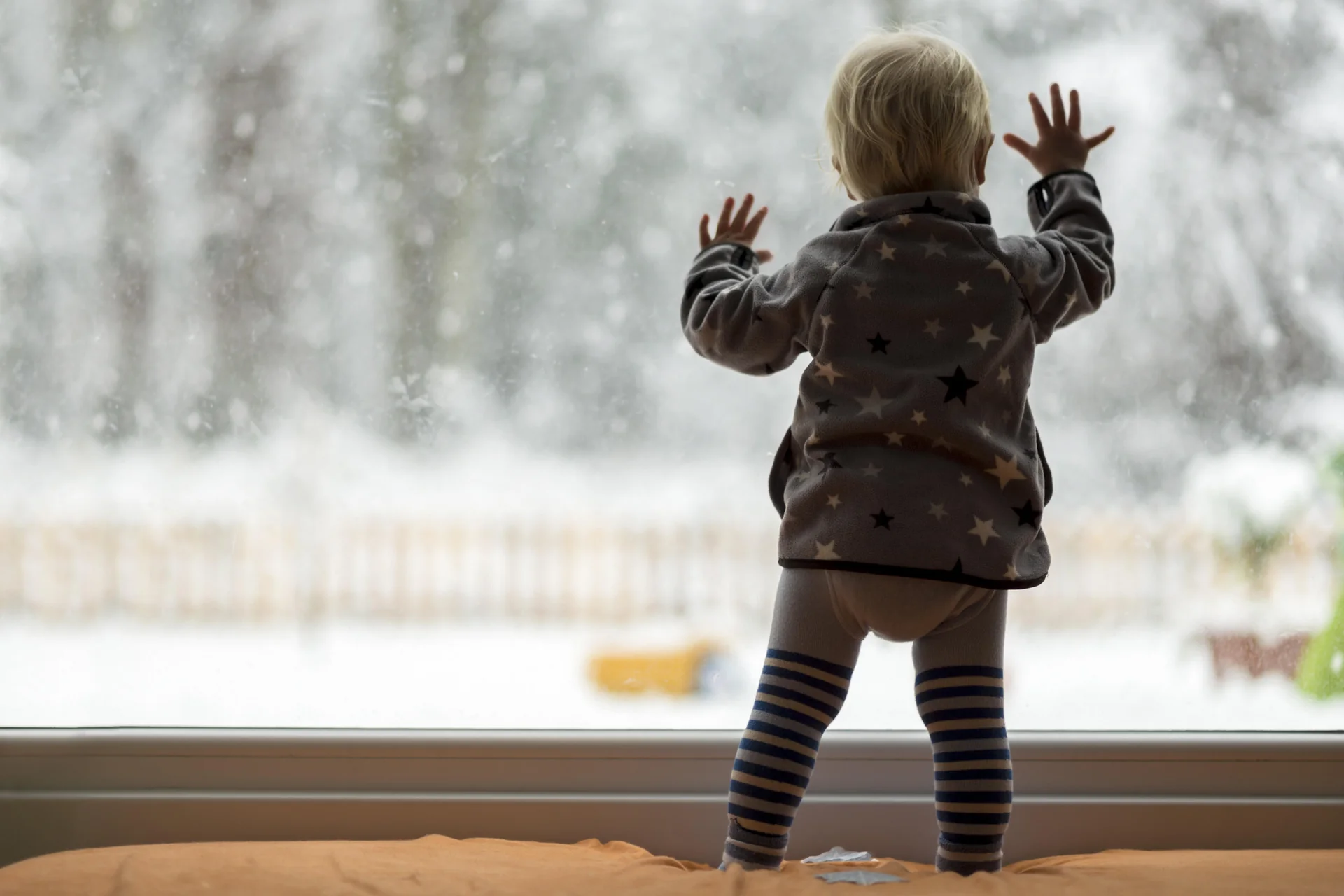 Family enjoying cozy indoor winter activities with toddlers