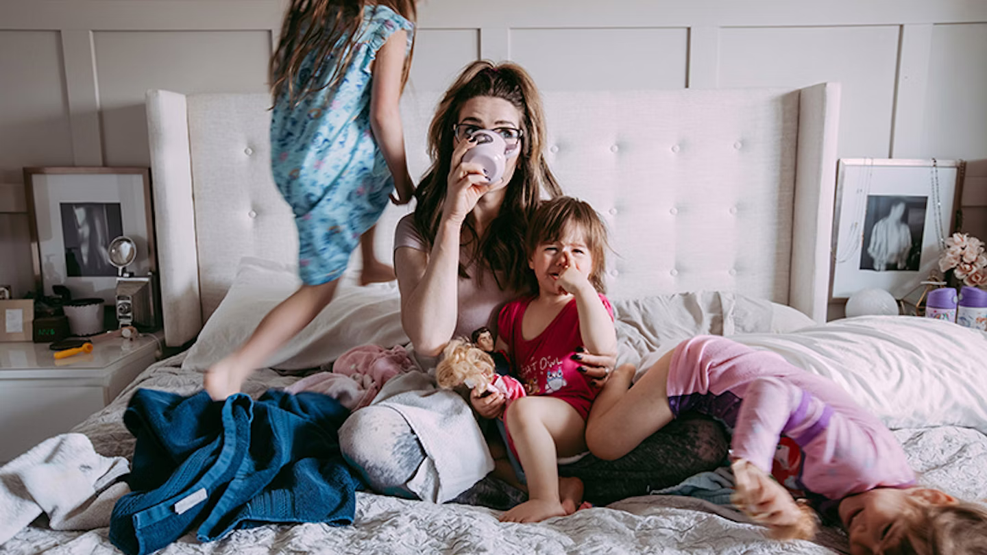 Mother resting while partner handles kids to reduce mental load